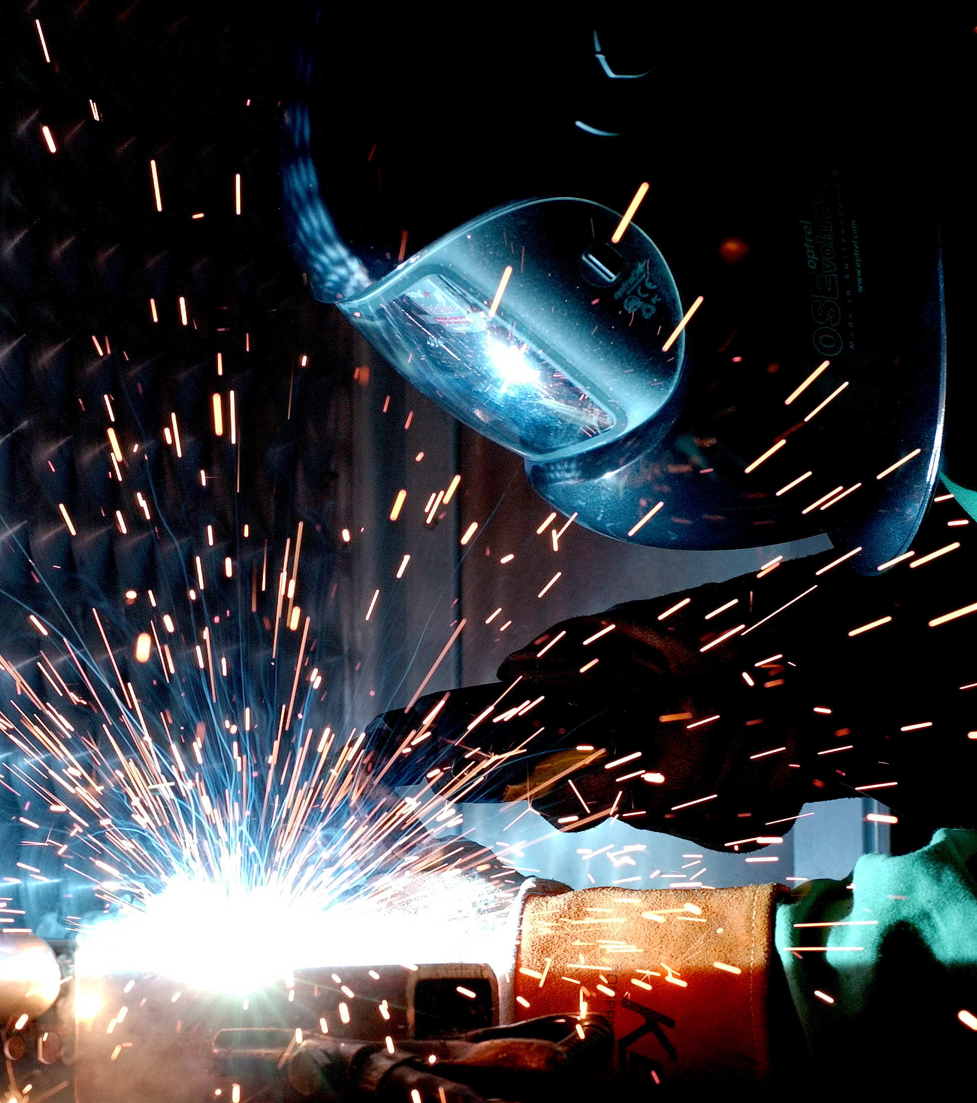 MIG welding in action showing proper technique and safety equipment